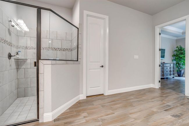 Bathroom with a stall shower and wood finished floors | Image 38