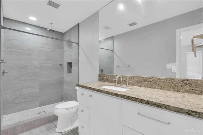 Good size bathroom with plenty of storage space | Image 13