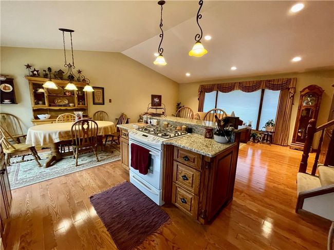 The sellers created this lovely great room. There are patio doors near the table that open to the decks. | Image 18