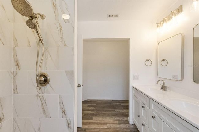 Start and end your day in this beautifully renovated en-suite bathroom with a walk-in shower and thoughtful finishes | Image 8