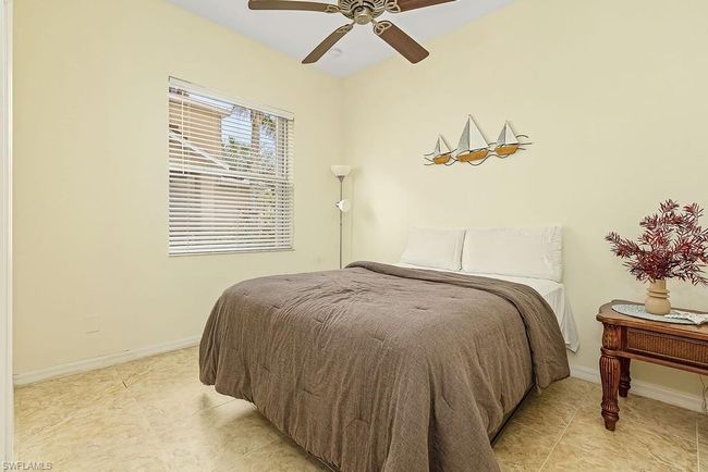 Bedroom featuring baseboards and a ceiling fan | Image 23