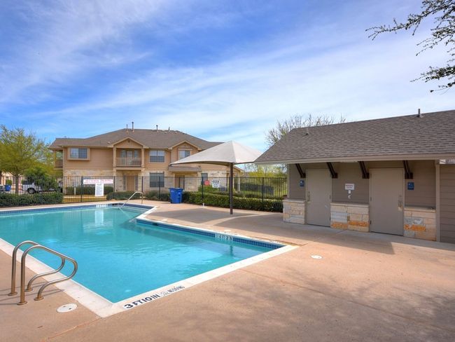 Community pool with fence and a patio area | Image 25