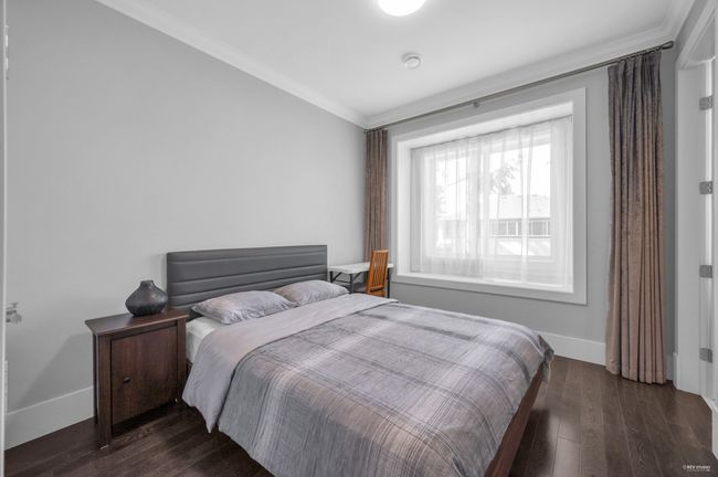 Bedroom featuring crown molding and hardwood / wood-style floors | Image 32