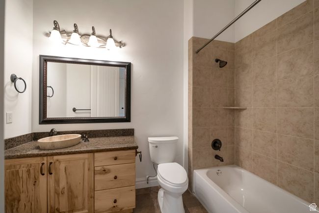 Full bathroom with baseboards, toilet, shower / bath combination, and vanity | Image 21