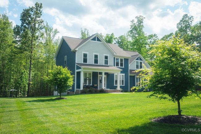 View of front of house featuring covered porch and a front yard | Image 43