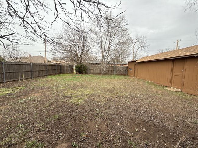 View of yard featuring a fenced backyard | Image 14