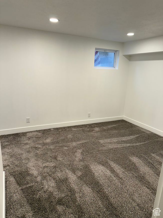 Basement with recessed lighting, dark colored carpet, and baseboards | Image 16