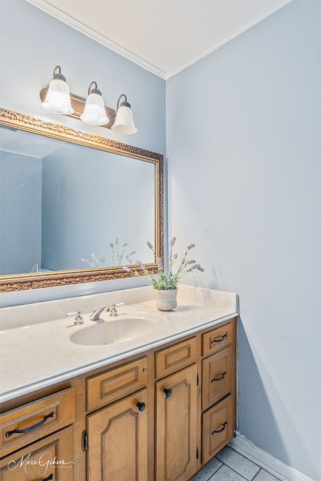 Bathroom featuring vanity and crown molding | Image 10