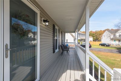 Deck featuring covered porch and a yard | Image 3