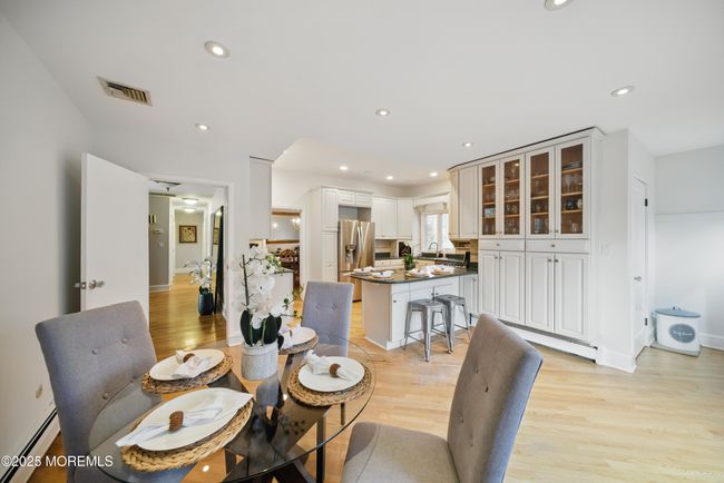 Eat in Kitchen with separate Dining, Coffee bar, SS appliances with sliders to LARGE deck with privacy and nature. | Image 11