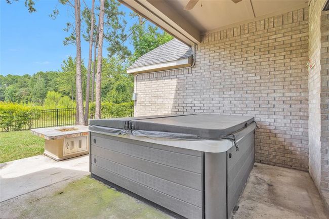 Unwind in your private jacuzzi while enjoying the warmth of your backyard firepit. | Image 30