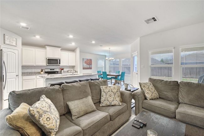 Living room featuring sink and a chandelier | Image 11