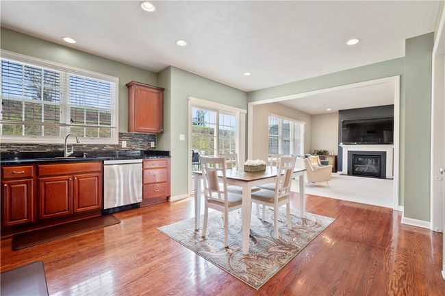The kitchen opens into the family room creating a nice open feel. | Image 6