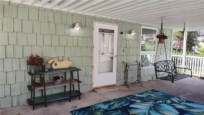 Entrance to property featuring covered porch. | Image 2