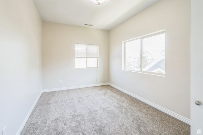 Carpeted empty room featuring baseboards | Image 37