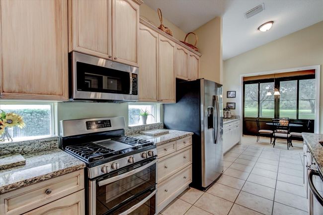 Beautiful Galley Kitchen and Granite counter tops and Stainless steel appliances all matching | Image 22