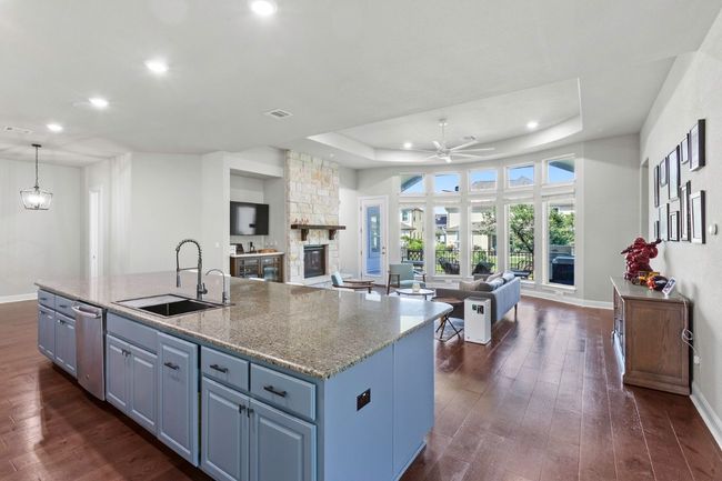 Kitchen featuring huge island, open floor plan, and recessed lighting | Image 5