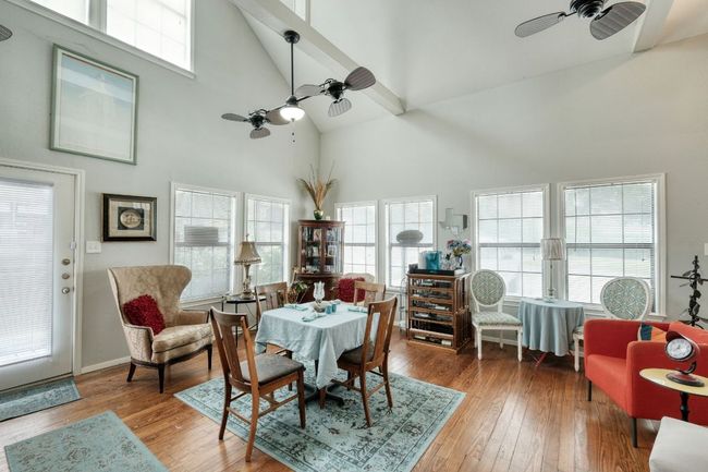 ceiling fan, high vaulted ceiling, and original / wood- floors | Image 11