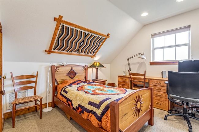 Bedroom featuring lofted ceiling, light carpet, recessed lighting, and a desk | Image 25