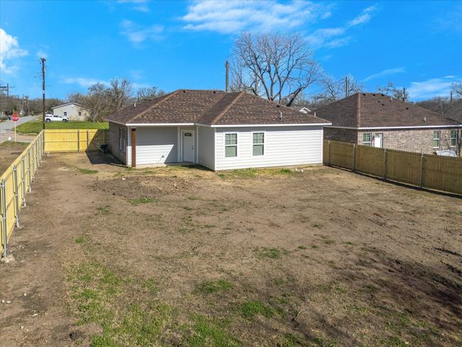 Back of house with a fenced backyard | Image 27