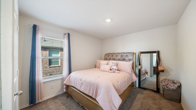 Carpeted bedroom featuring baseboards | Image 18