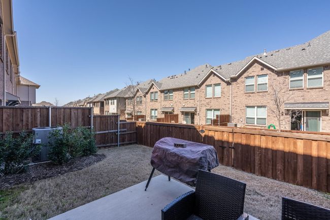 View of patio / terrace with a residential view, grilling area, a fenced backyard, and cooling unit | Image 21