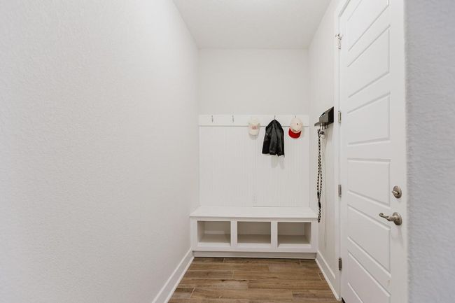 Coat rack and storage space off garage entrance on main level | Image 22