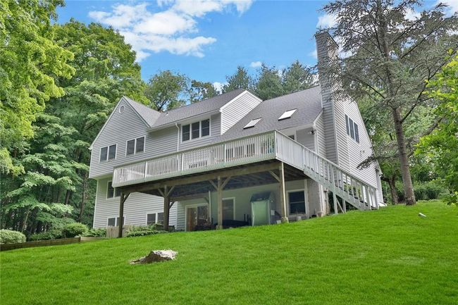 Plenty of lawn and outdoor private space. There is a large raised flat area seen on the left - plenty of room to play and kick the ball around. | Image 29