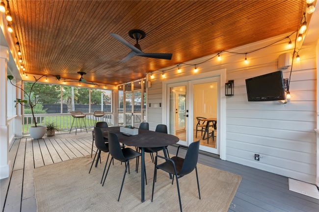 Enjoy outdoor dining and setting in this screened-in porch | Image 23
