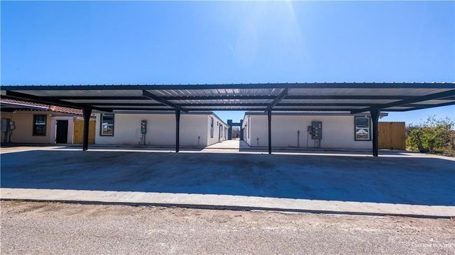 Garage featuring covered parking | Image 13
