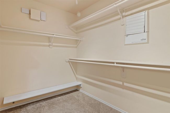 The primary bathroom has a large walk in closet with plenty of space for all your storage needs. | Image 17