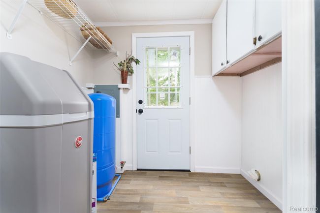 Laundry room was updated.... New holding tank, water softener, & electrical panel | Image 18