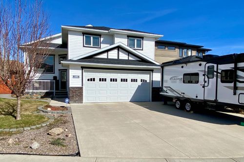 100 Riverland Close W, Home with 4 bedrooms, 3 bathrooms and 5 parking in Lethbridge AB | Card Image
