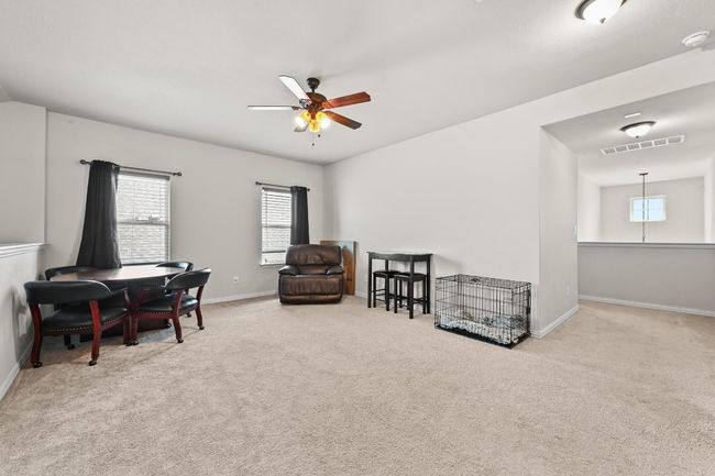 game rm/den or office featuring a ceiling fan, plenty of natural light, and carpet flooring | Image 19
