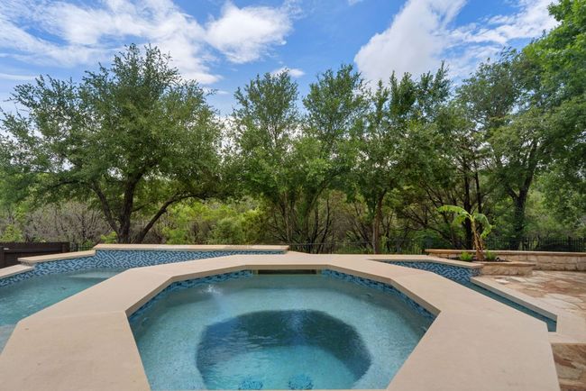 The attached heated spa offers a luxurious place to relax and recharge, whether you're enjoying a quiet morning soak or unwinding under the stars. | Image 31