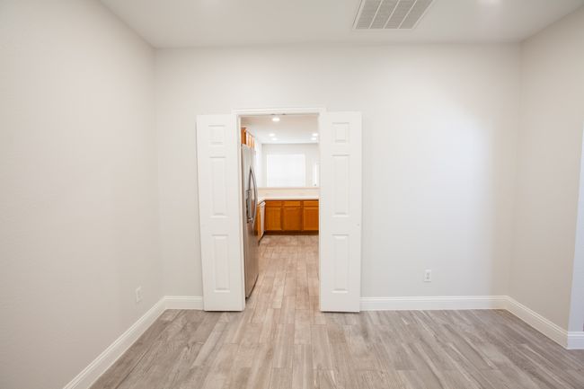 Spare room with light wood-style flooring | Image 9
