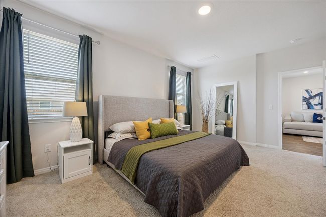 Bedroom with light carpet and recessed lighting | Image 27