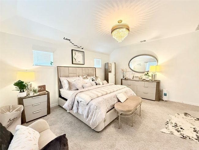 Bedroom with carpet and a chandelier | Image 28