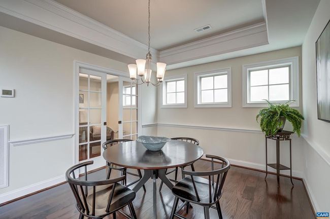 Dining room with french doors leading to home office/wine room. | Image 22
