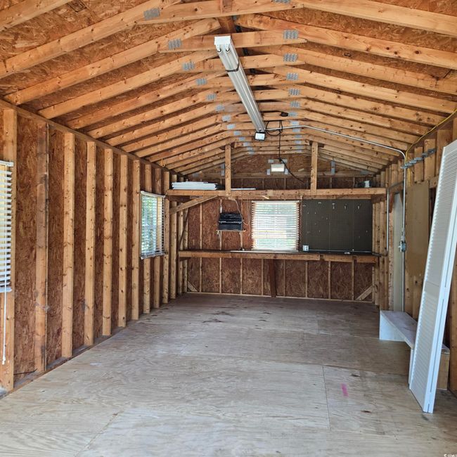View of Garage with extra storage room | Image 38