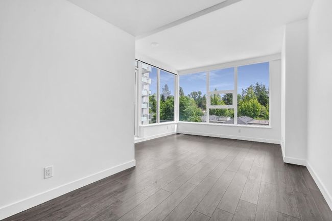 Unfurnished room with dark wood finished floors | Image 7