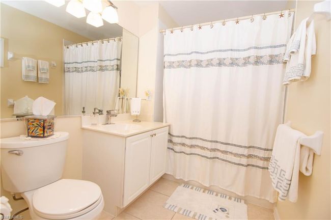 Guest bath offers tiled shower and tub. | Image 23