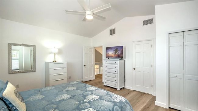 Guest Bedroom upstairs featuring wood finished floors, high vaulted ceiling, and ceiling fanG | Image 25