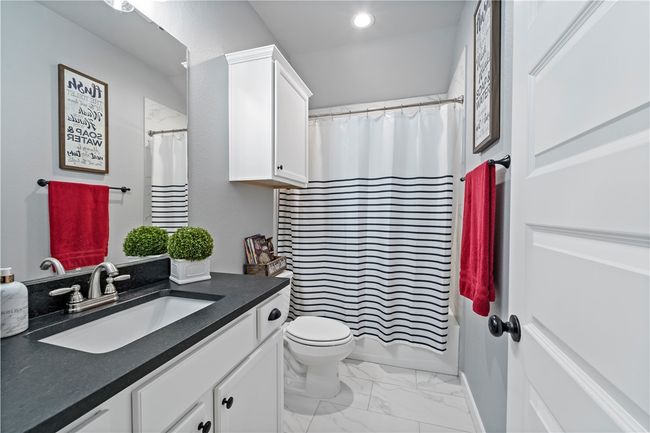 Bathroom featuring marble finish floor, recessed lighting, toilet, and vanity | Image 7