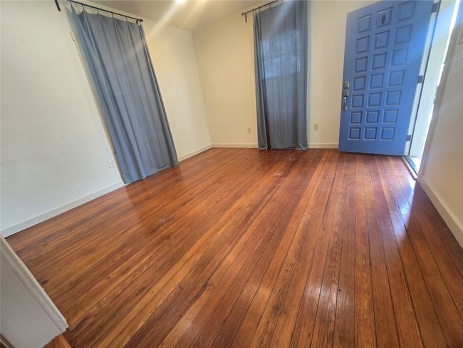 Unfurnished room featuring hardwood / wood-style floors and baseboards | Image 24