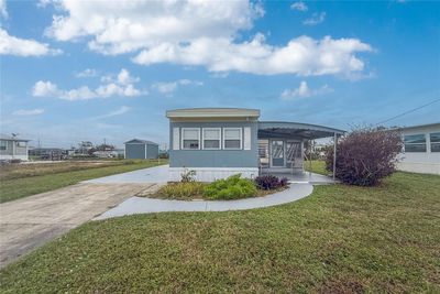 Another view of the front and driveway. | Image 2