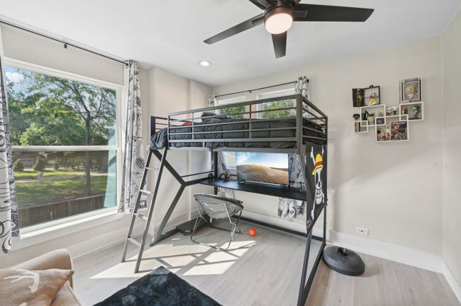Bedroom featuring wood finished floors, baseboards, a ceiling fan, and recessed lighting | Image 35