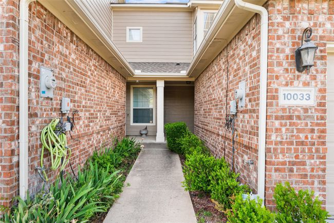 Property entrance with brick siding | Image 4