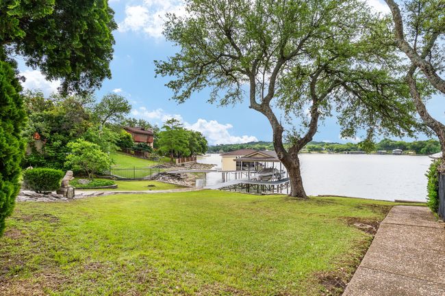 View of yard featuring fence and a water view | Image 37