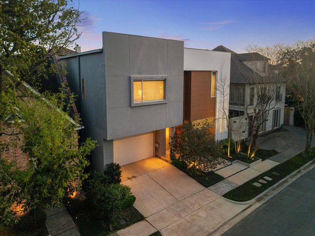 Modern design with touch of color on the front facade - the juxtaposition of simple geometric shapes create a striking contemporary silhouette - so dramatically displayed with night lighting! | Image 43